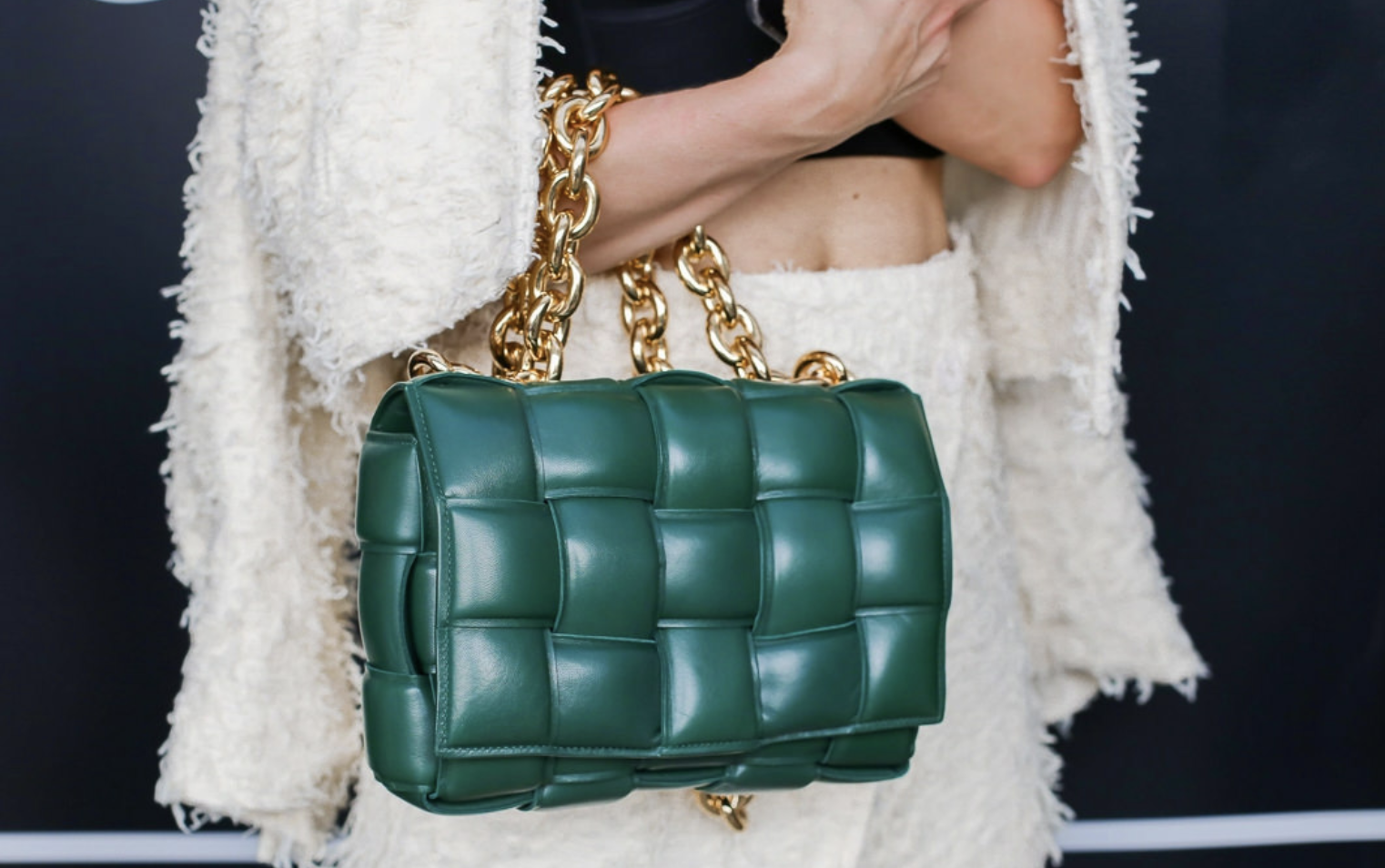 The Iconic BOTTEGA VENETA Cassette Bag in Intrecciato Weave. BOTTEGA VENETA Cassette Bag in bold green with a chain strap.