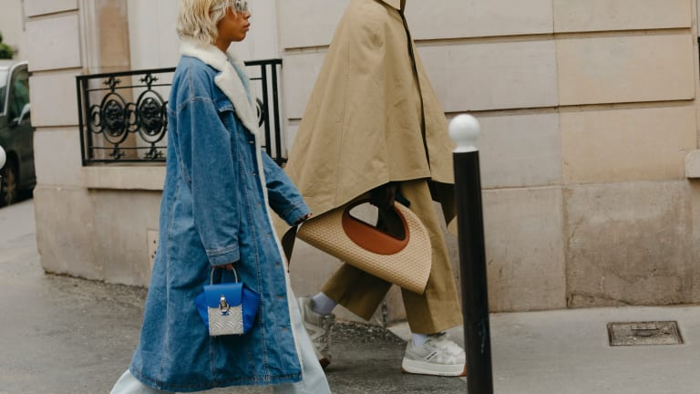  Model with a designer handbag under the spotlight