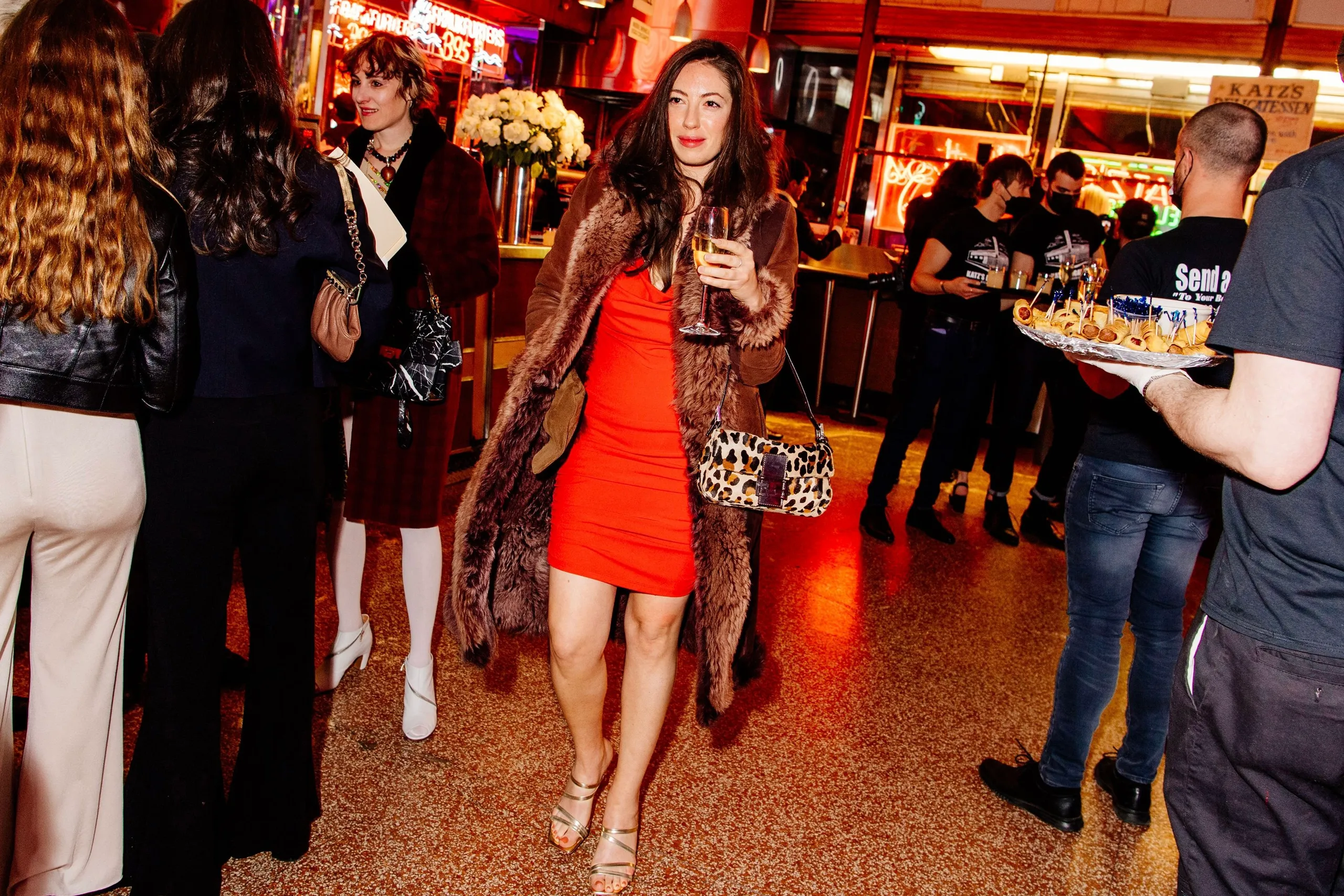 Woman walking confidently in the city with a minimalist handbag without any visible logos Woman walking confidently in the city with a minimalist handbag without any visible logos