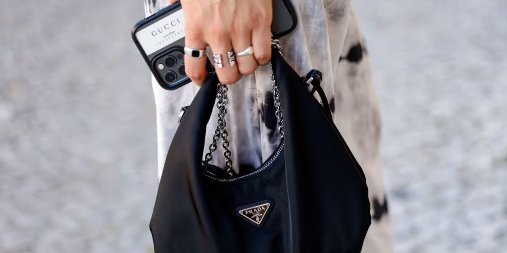 Replica PRADA crossbody at a European cafe